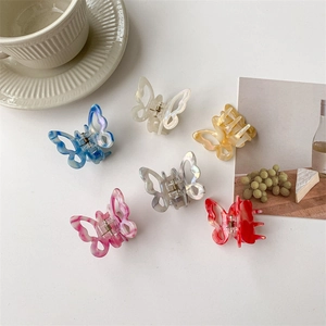 Elegant butterfly hair claw clips in six colors with marble texture on white background