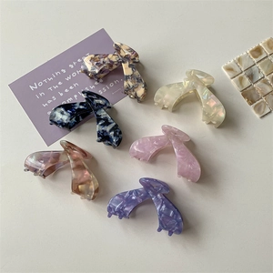 Set of 6 chic acetate hair claws in various marble and floral patterns for women