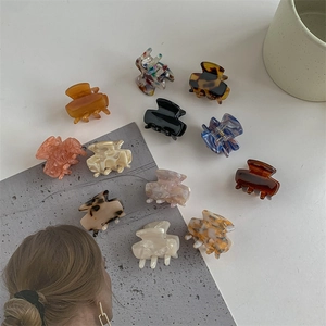 Set of 12 minimalist acetate mini hair claws in solid colors and marble patterns