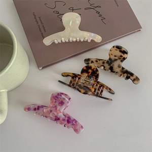Elegant large acetate claw clips set in marble and tortoiseshell textures for women hair