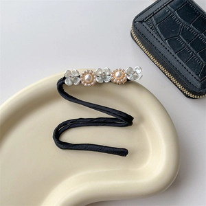 Elegant black satin hair bun maker with white flowers and pearl embellishments