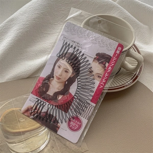 Detail of black invisible hair comb clip in Japanese style packaging for styling back hair
