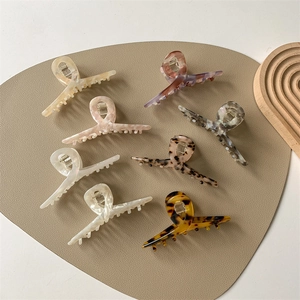 French vintage style acetate hair claws set with marble and tortoiseshell patterns