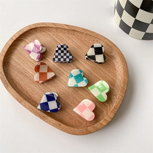 Set of 8 heart-shaped checkerboard mini hair claws in various vibrant colors