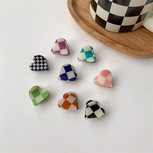 Set of 8 heart-shaped checkerboard mini hair claws in various vibrant colors for women