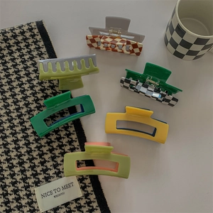 French vintage acetate hair claws in checkerboard and solid colors for elegant styling