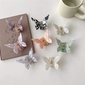 Set of 7 colorful acetate butterfly hair claws in various marble and pearlescent finishes