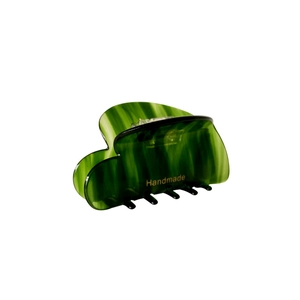 Green marble acetate hair claw clip with golden handmade logo on a white background