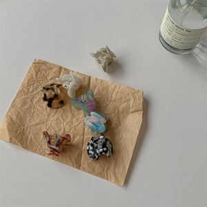 Mini acetate hair claw clips set in tortoiseshell and marble patterns for women