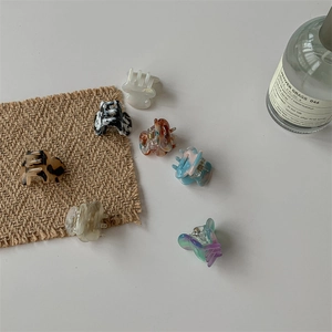 Mini acetate hair claw clips in tortoise shell and marble patterns for women and girls