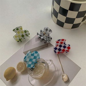 Chic checkerboard mini hair claws in four colors with glossy finish for elegant styling