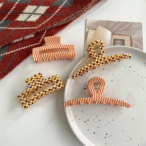 Retro acetate hair claw set with chic checkerboard and orange stripe geometric patterns