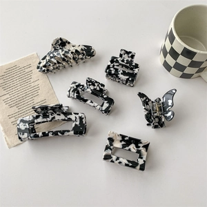 Lot de 6 pinces à cheveux chic à motif vache avec motifs marbrés noirs et blancs