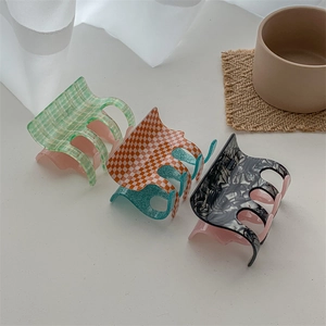 Three-piece set of checkered acetate hair claws in pink, green, and orange colors