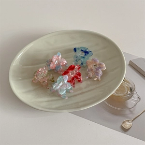 Floral acetate hair claw clips with marble texture in various pastel gradient colors