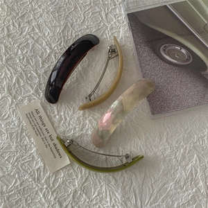 Elegant acetate hair clips set in marble and tortoiseshell patterns for chic styling