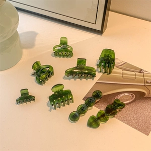 Elegant green acetate hair claw set and clips with a vintage resin finish for hair styling