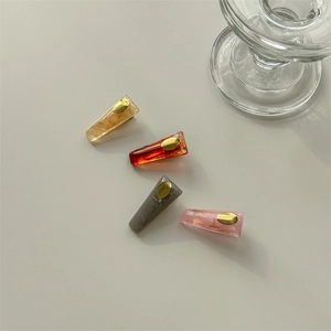 Minimalist acrylic hair clips set in amber and marble textures for women styling