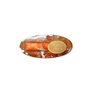 Minimalist amber acrylic small hair clip with elegant marble swirl and gold metal plate