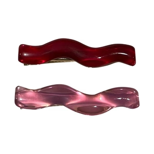 Set of two wavy translucent resin hair clips in burgundy and pink for daily styling