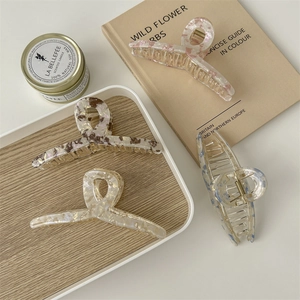 Elegant large amber acetate hair claw clips set in four diverse patterns for women