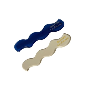 Blue and beige wavy barrette hair clips set for women with gold lettering detail
