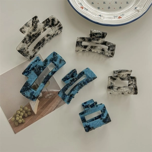 Set di eleganti fermagli per capelli in acetato con motivo marmorizzato nero e bianco