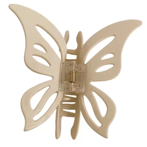 Elegant cream beige acetate butterfly hair claw clip with cutout wings and spring mechanism