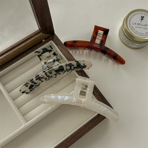 Three-piece set of elegant French acetate hair claws in tortoise shell and marble patterns