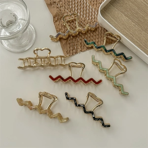 Elegant gold alloy wave hair claws set with colorful inlaid patterns on white tray