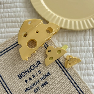 Creative cheese shaped hair claw set with hollow triangular pattern in creamy yellow color