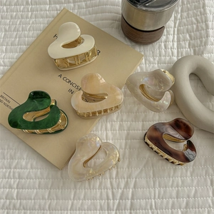 Irregular acetate claw clips set in various colors with golden metal base for women