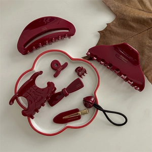 Deep red acetate hair claw set including bow clips and accessories in vintage style