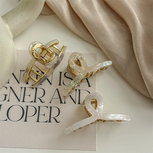 Elegant cream acetate hair claw clip set with golden metallic springs for women hair styling