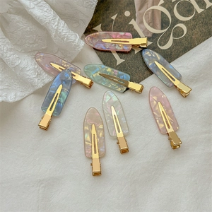 Set of 7 colorful dreamlike acetate hair clips with gradient marble patterns for women