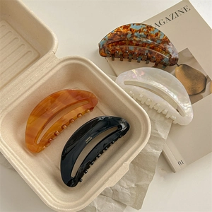 French style acetate hair claws set in black amber pearl white and tortoiseshell finishes