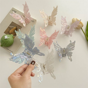 Pinces à cheveux papillon iridescentes aux tons pastel pour coiffures de femmes