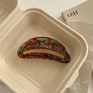 Detail of tortoise shell acetate claw clip with gold France Handmade engraving
