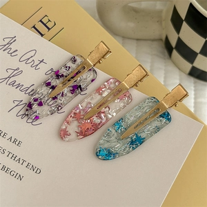 Set di 3 fermagli per capelli trasparenti con glitter a stella e base dorata