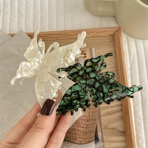 French retro butterfly hair claw clips in cream marble and dark green plaid patterns