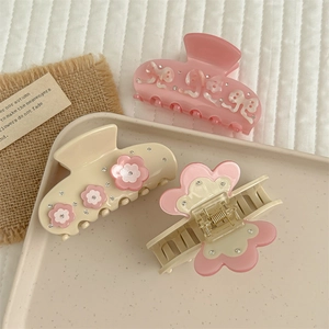 Elegant floral acetate hair claws with rhinestones in pink and cream beige colors