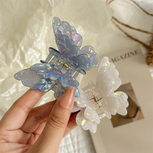 Iridescent butterfly hair claws in shimmering blue and white with gold metal spring