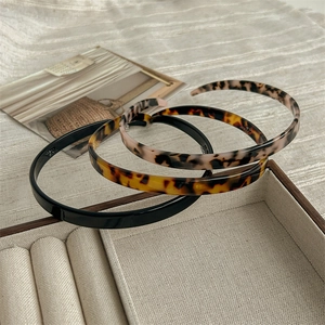 Three-piece set of thin minimalist headbands in black and tortoise shell patterns