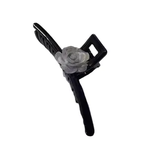Elegant large camellia hair claw clip with grey 3D rose flower on black glossy resin base