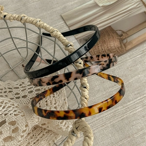 Three-piece resin sunglasses-style headband set in black and tortoise shell patterns