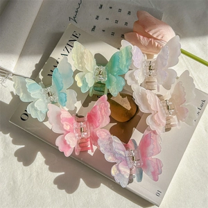Pinces à cheveux papillon élégantes aux motifs marbrés pastels et à la finition nacrée
