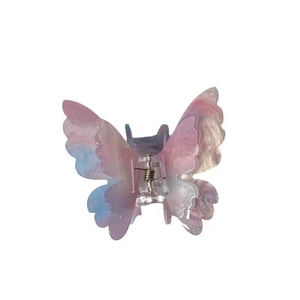 Pince à cheveux papillon colorée avec dégradé rose bleu violet et finition pailletée