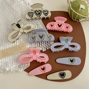Sweet heart hollow and bow acetate hair claws set in assorted macaron pastel colors