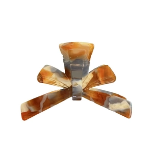Elegant 3D bow hair claw clip with tortoise shell marble texture for women