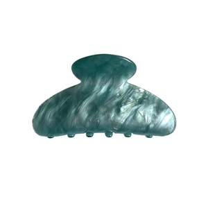 Elegante pinza per capelli in acetato blu marmorizzato con finitura lucida da donna
